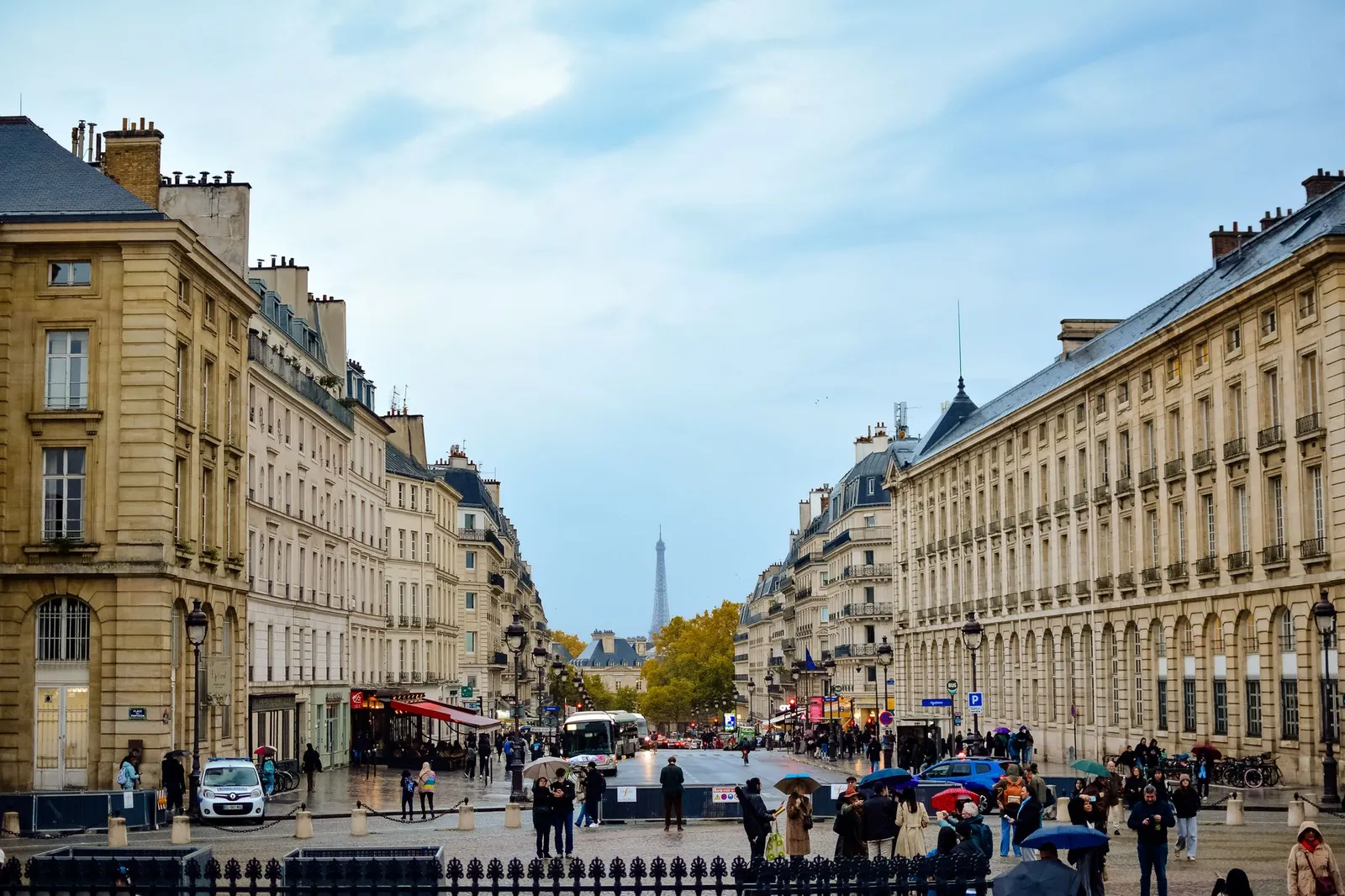 Street scene in the 11th arrondissement with local cafés and Parisians walking
